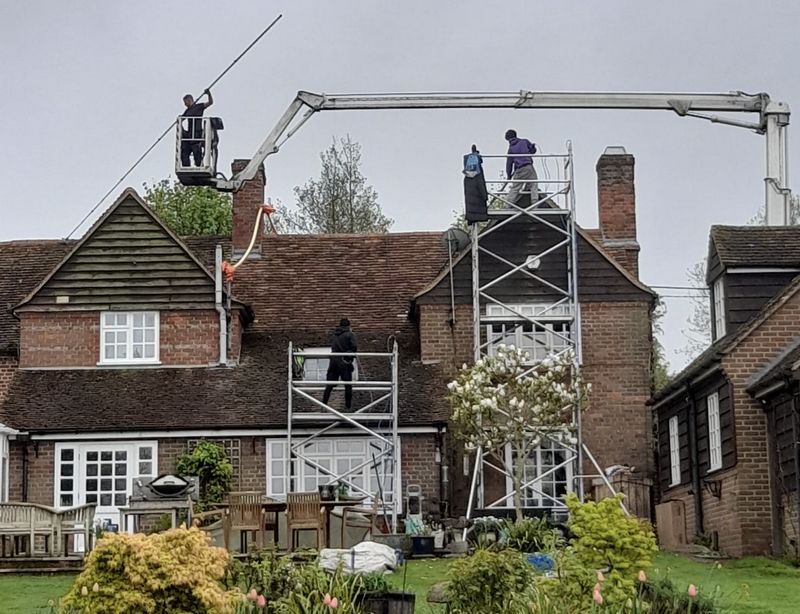 The Moss Cleaners using cherry picker and scaffolding to clean roof safely and professionally in 16 Horton Rd, Stanwell Moor, Staines TW19 6BU, UK, 16 Horton Rd, Stanwell Moor, Staines TW19 6BU, UK